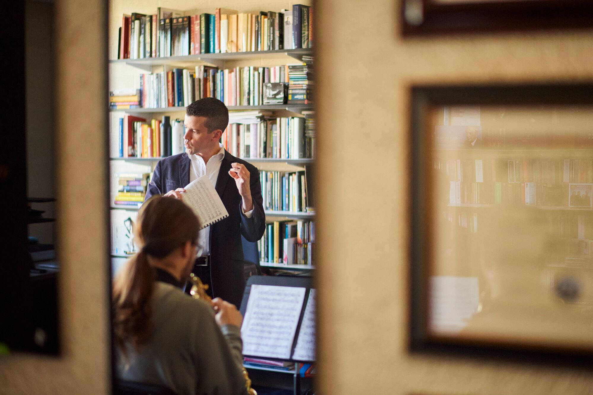 Music professor, Dan Graser teaching a student.